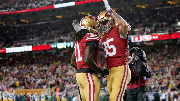 January 20, 2024; Santa Clara, CA, USA; San Francisco 49ers tight end George Kittle (85) celebrates with wide receiver Brandon Aiyuk (11) after scoring a touchdown against the Green Bay Packers during the second quarter in a 2024 NFC divisional round game at Levi's Stadium. Mandatory Credit: Kyle Terada-USA TODAY Sports